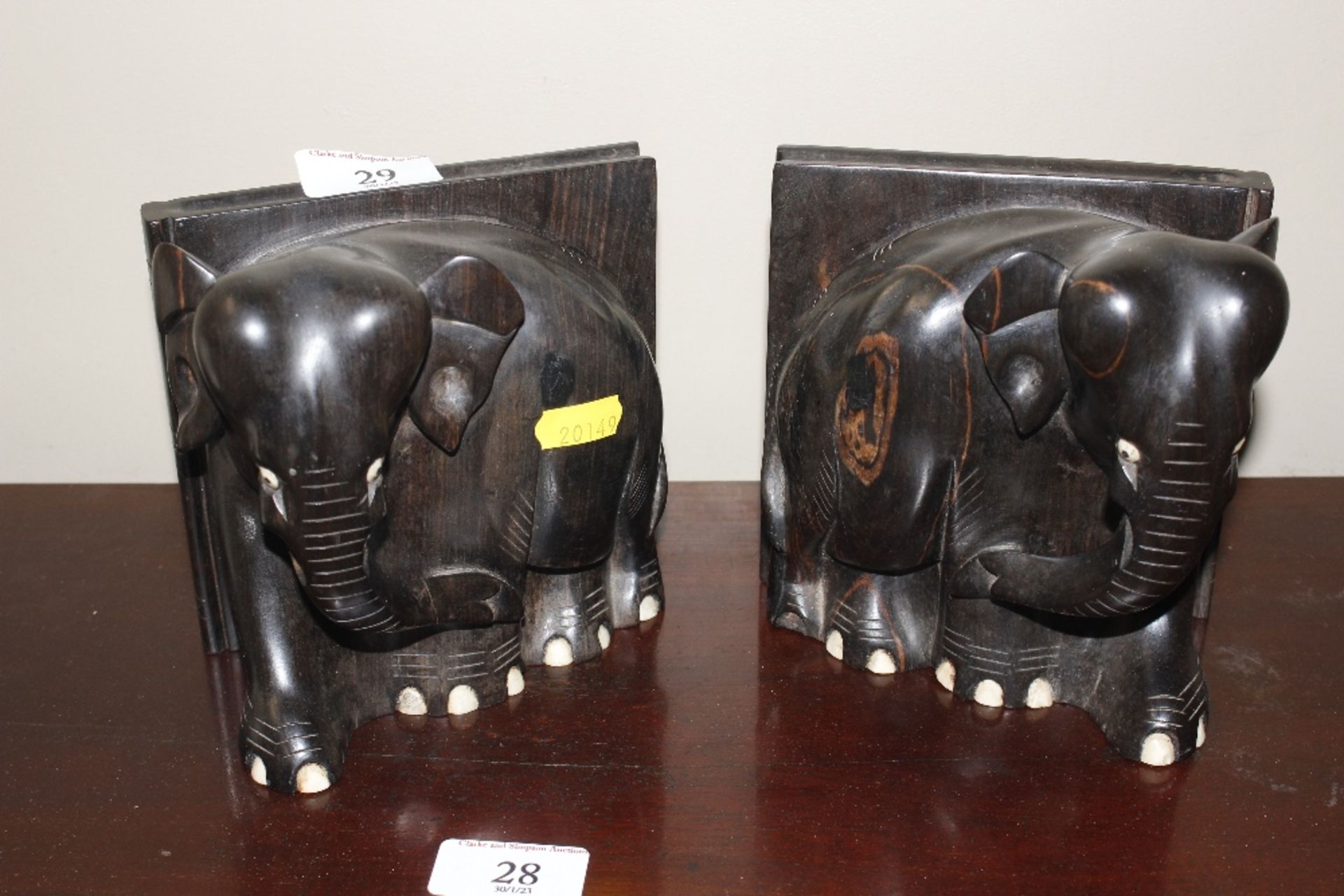 A pair of ebony elephant book ends