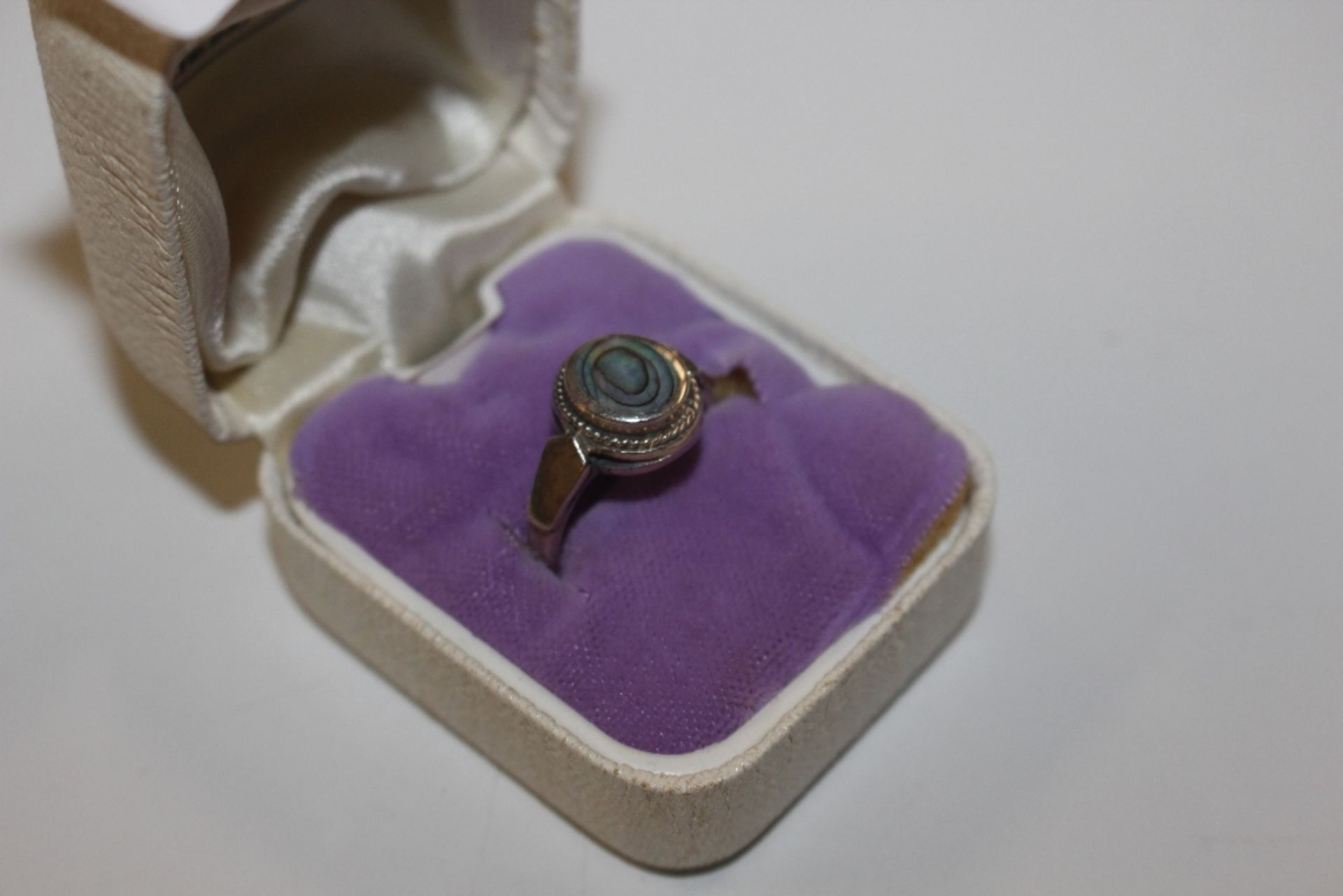 A 925 and abalone shell mounted ring