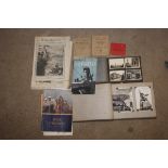 A box of ephemera and photo albums mainly military