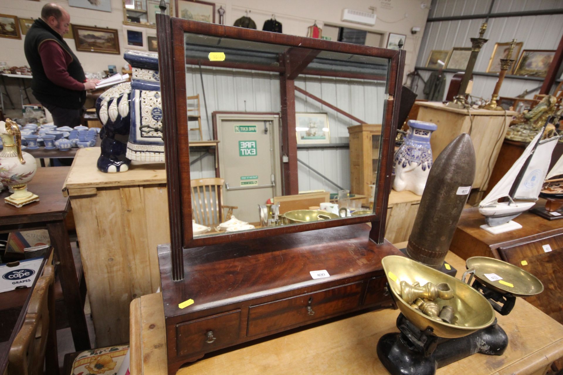 A 19th Century swing frame mirror raised on box ba