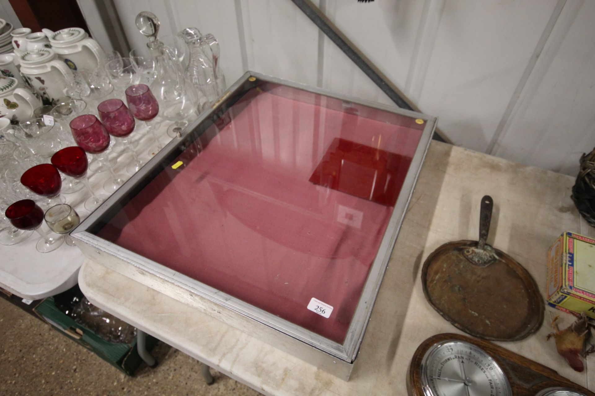 A metal table top display case