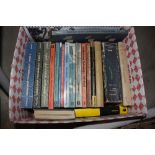 A box of various workshop related books with at