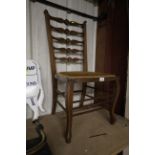 An Edwardian ladder back chair