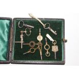 A box of pocket watch keys and others