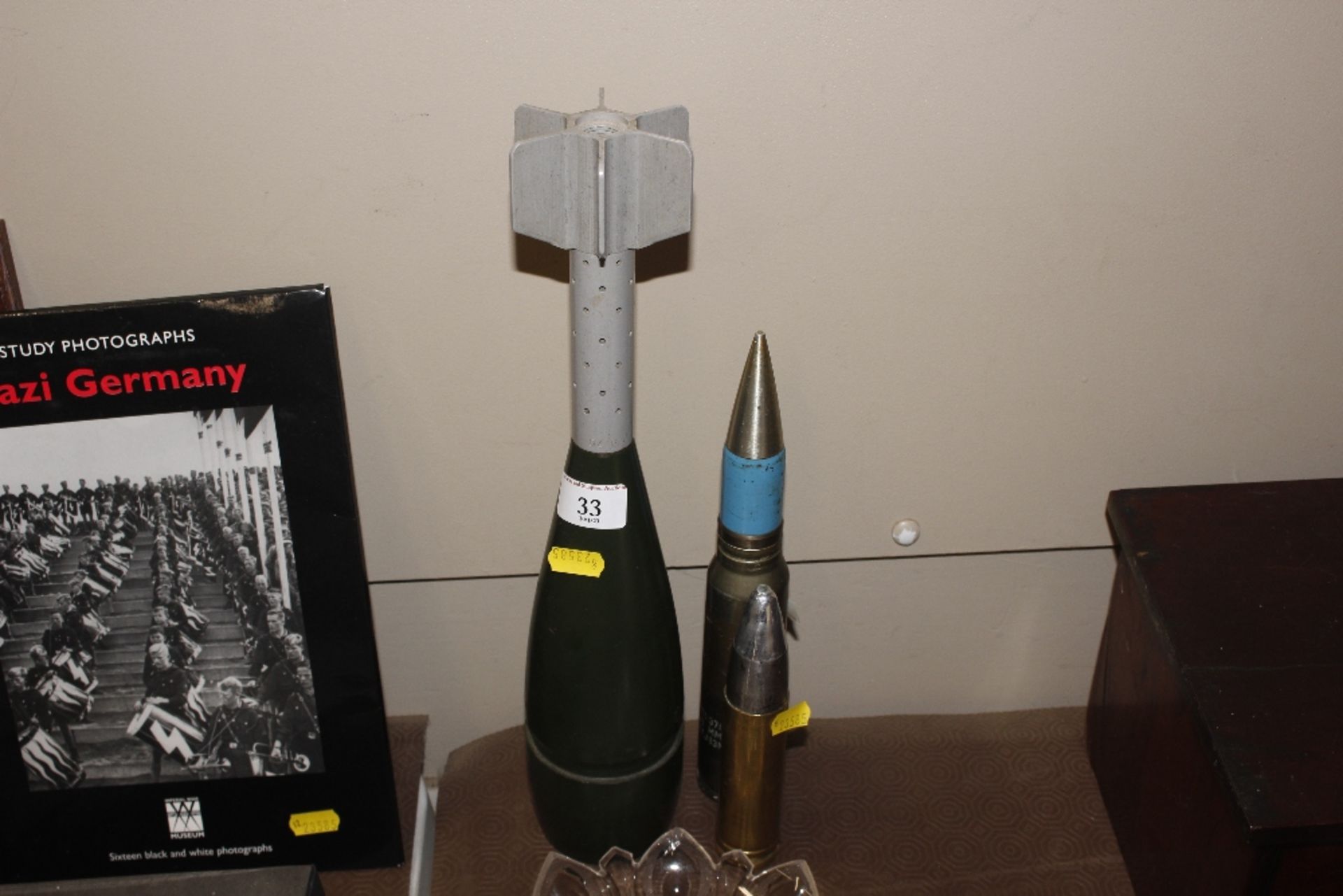 An 81mm mortar projectile with various cannon roun