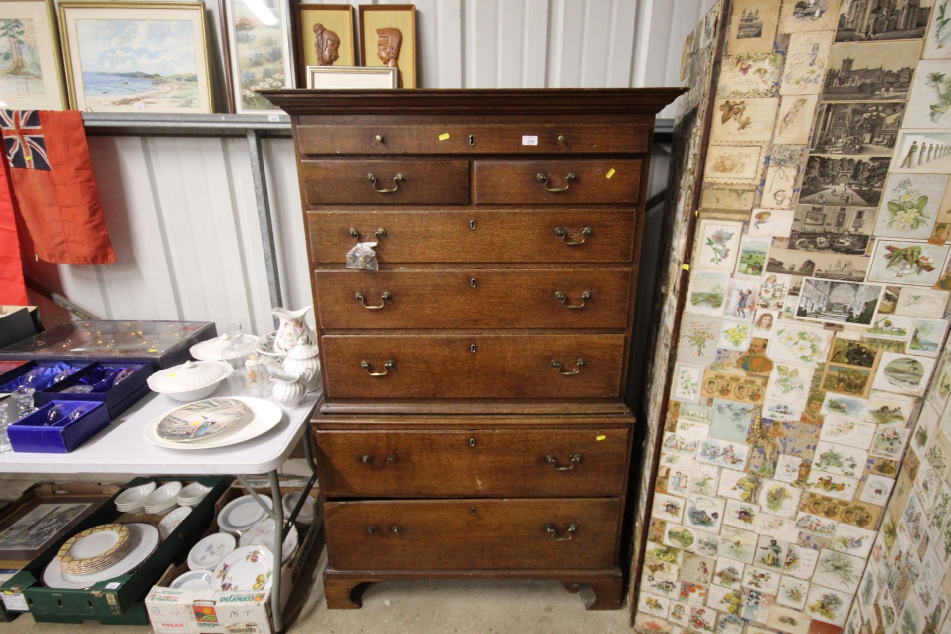 An antique chest on chest raised on bracket feet