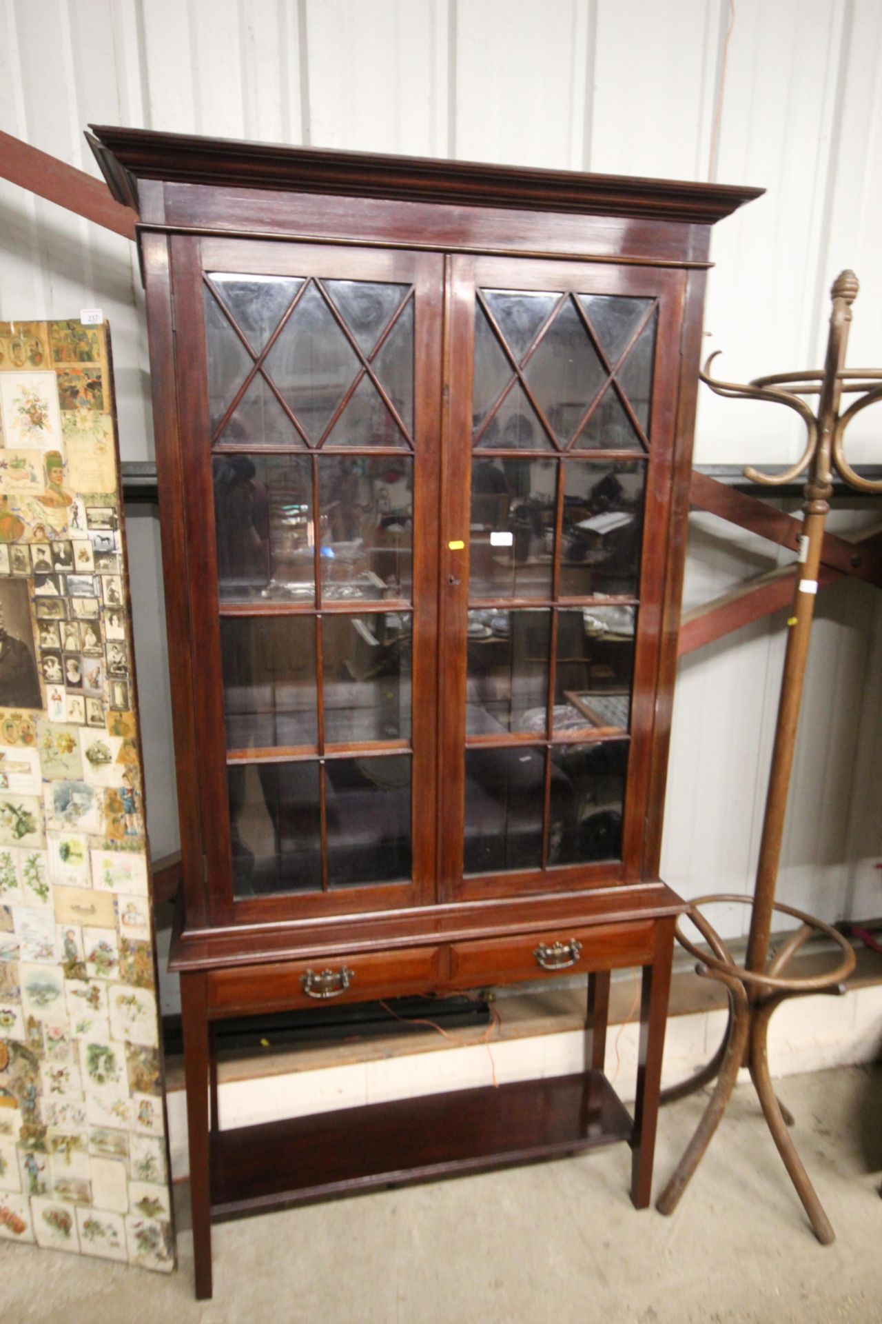 A glazed mahogany bookcase, fitted two drawers rai