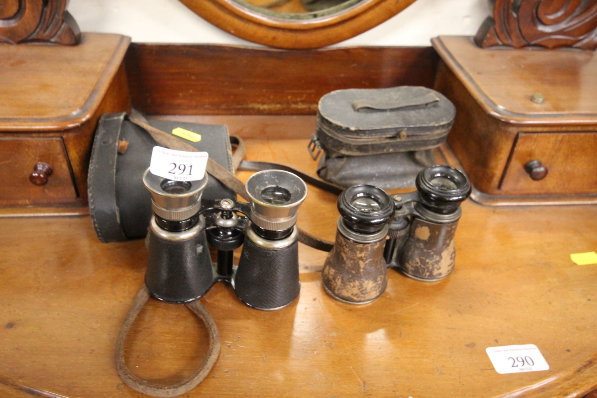 Two pairs of binoculars in case