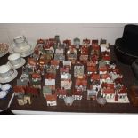 A collection of Mudlen model cottages collection w