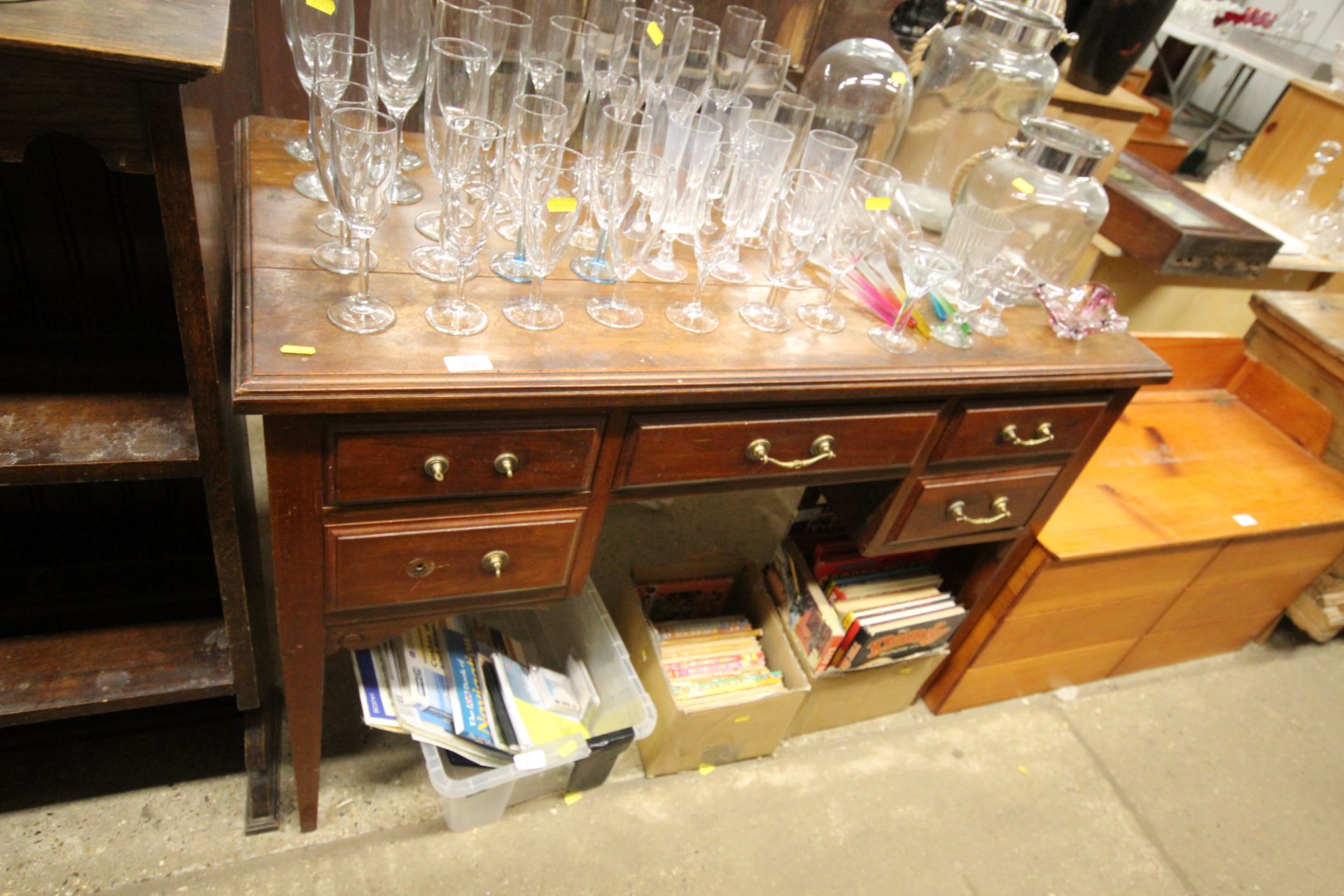 A mahogany desk fitted five drawers raised on squa