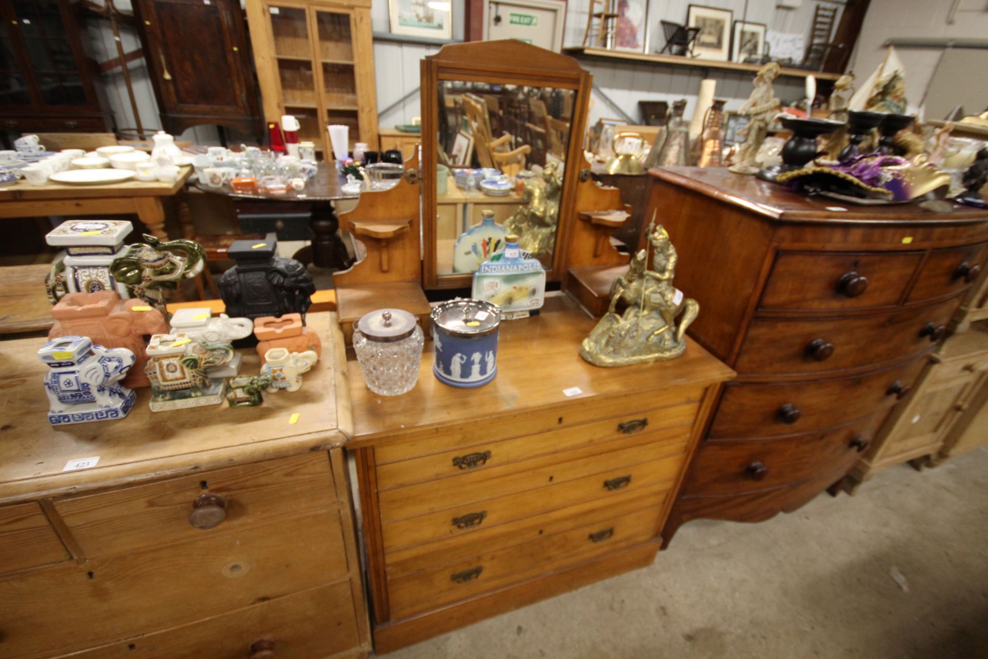 A satin wood dressing chest fitted three drawers