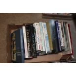 A box of various art related books