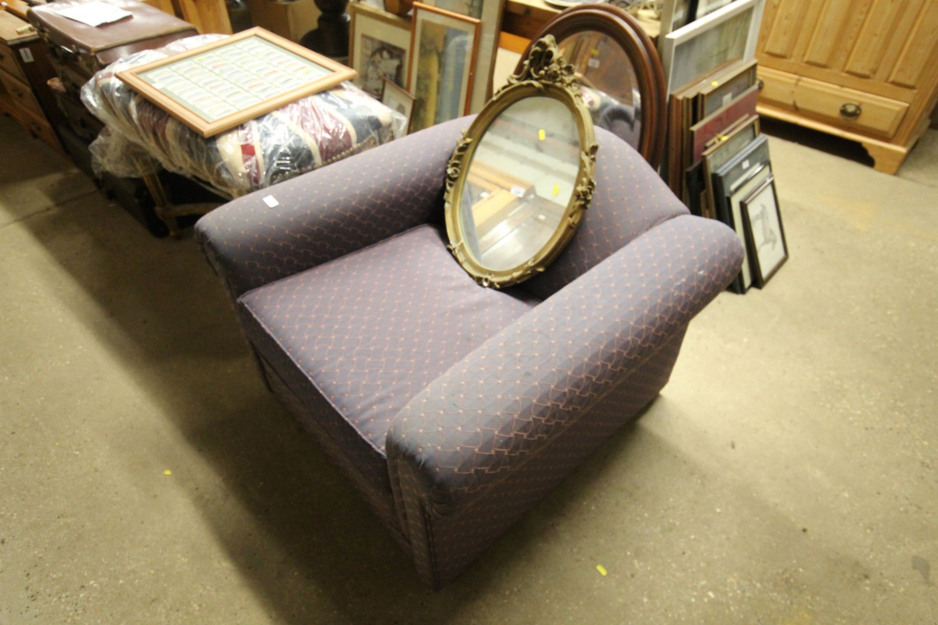 A deep seated upholstered armchair