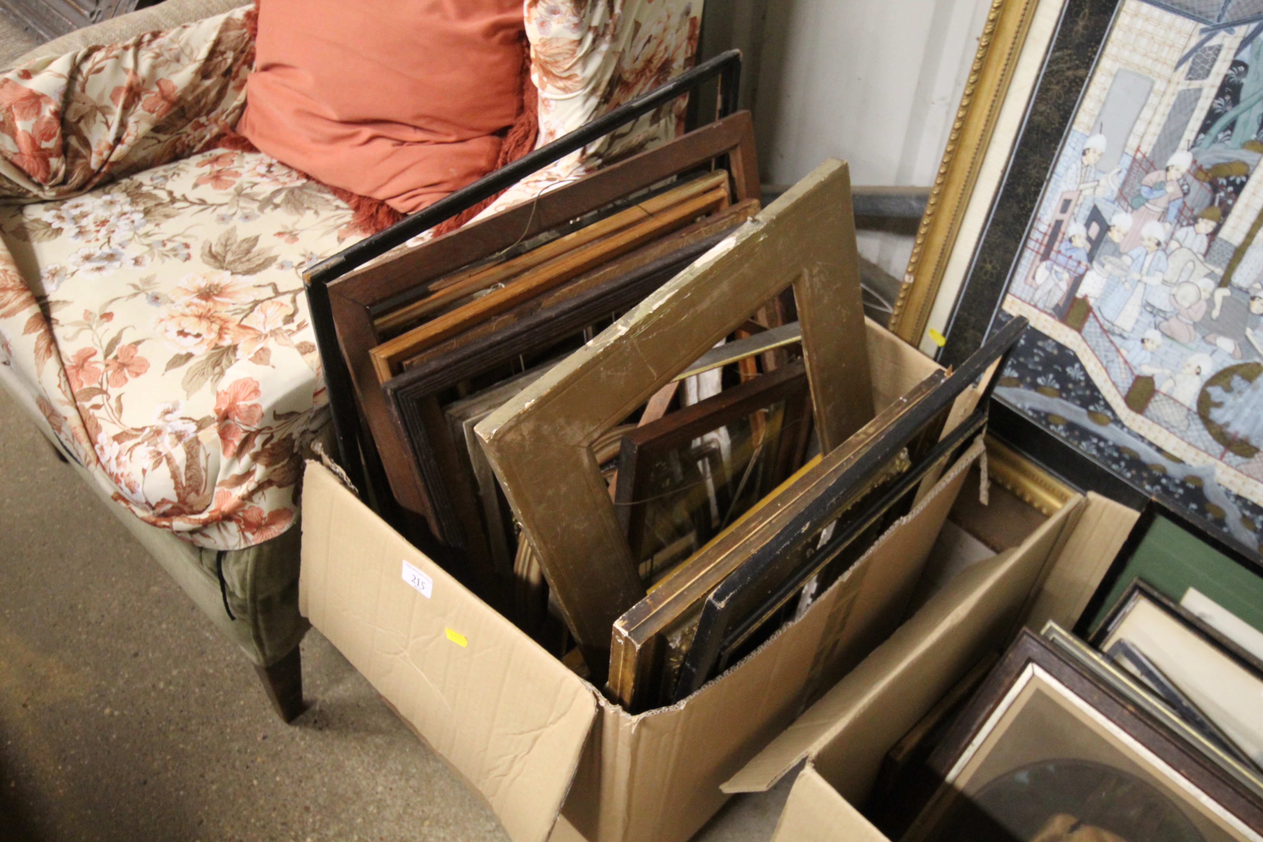 A box of various picture frames