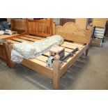 A stripped pine double bed frame approx. 57" wide