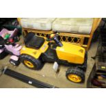 A child's pedal JCB tractor