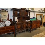 A geometric and carved oak mounded sideboard (keys