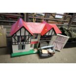 A large children's dolls house and some contents