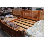 A hardwood framed double bed approx. 61" wide