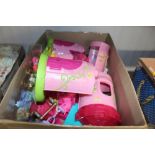 A box containing various toy ponies together with