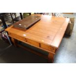 A square pine coffee table fitted single drawer