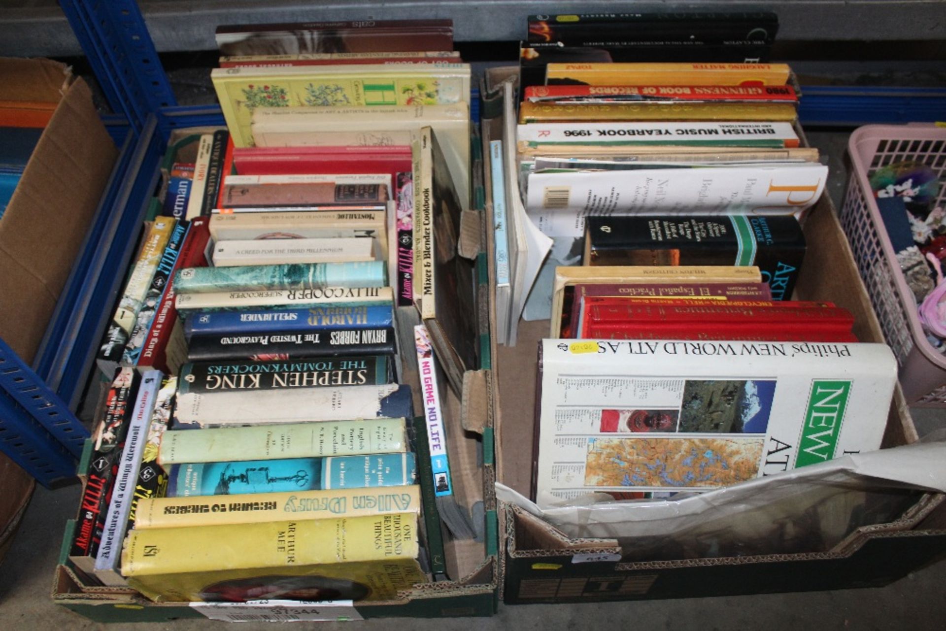 Two boxes containing various books