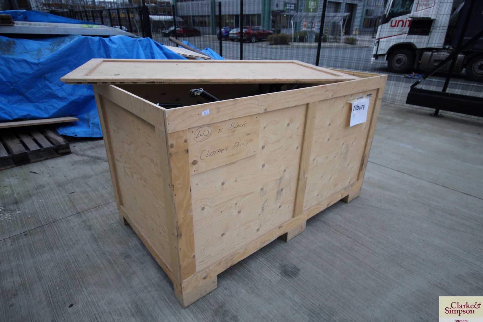 Large wooden pallet box with a large quantity of coat rails. V