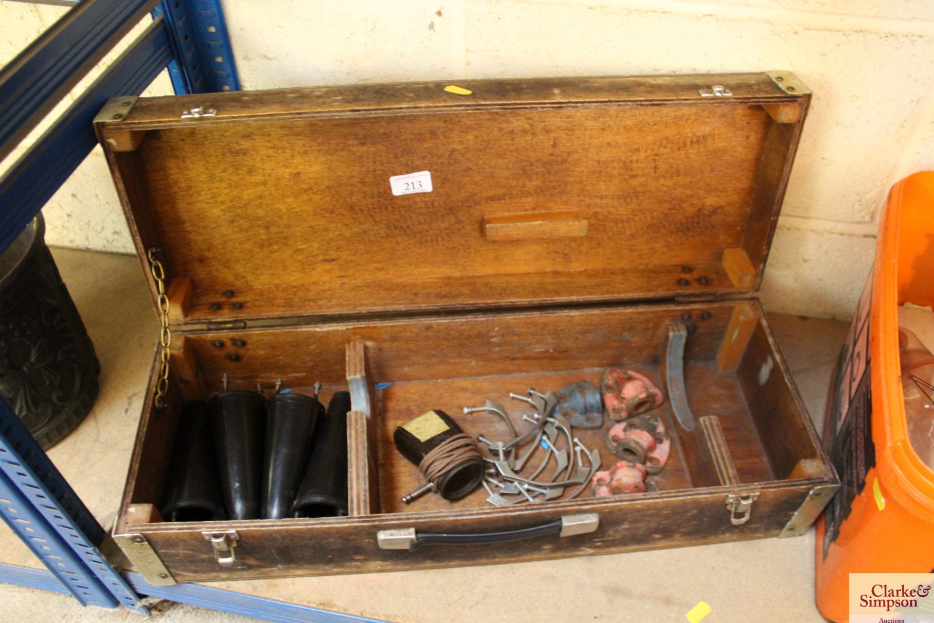 A small wooden box and contents of chair legs etc.