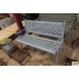 A cast iron and wooden garden bench