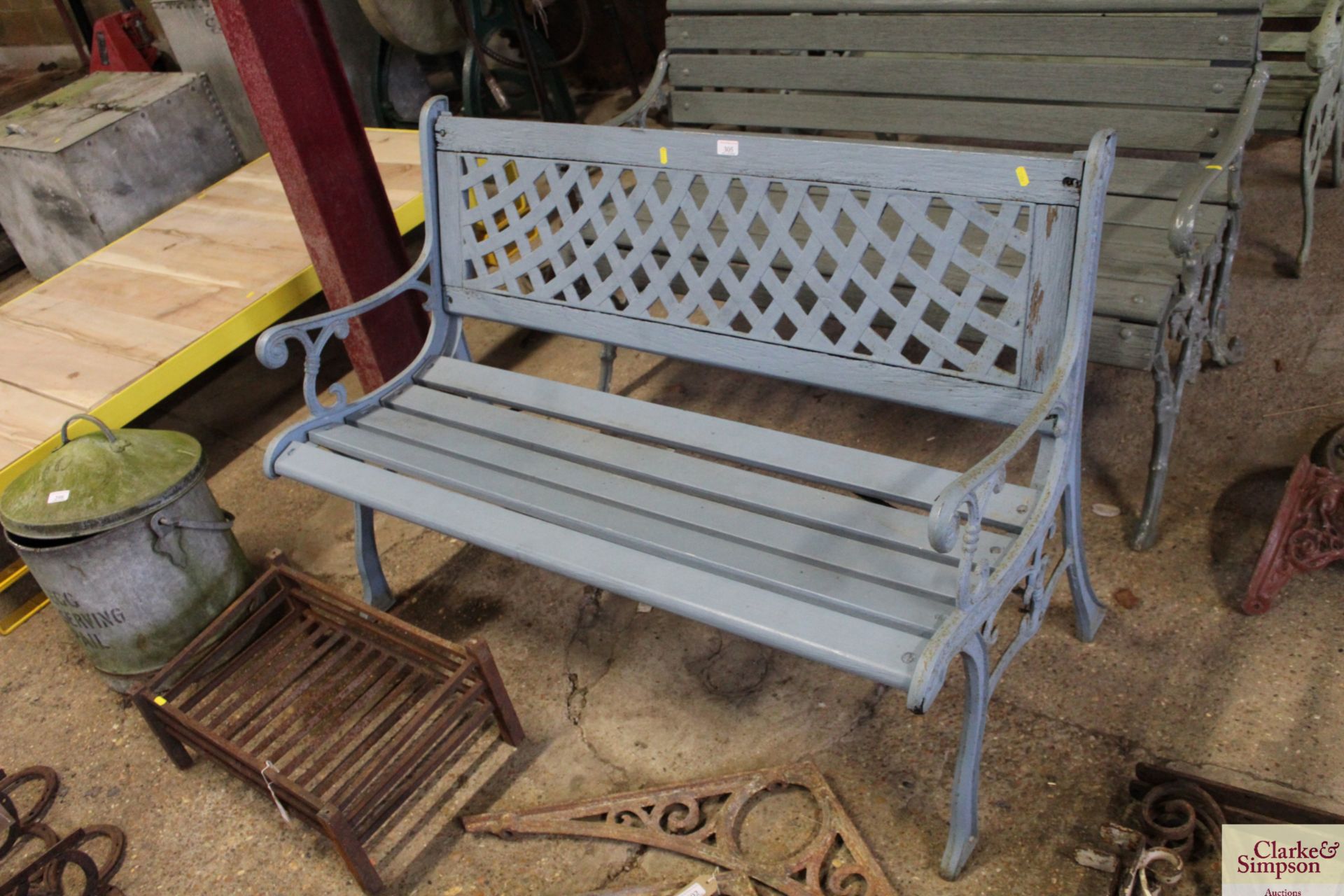 A cast iron and wooden garden bench