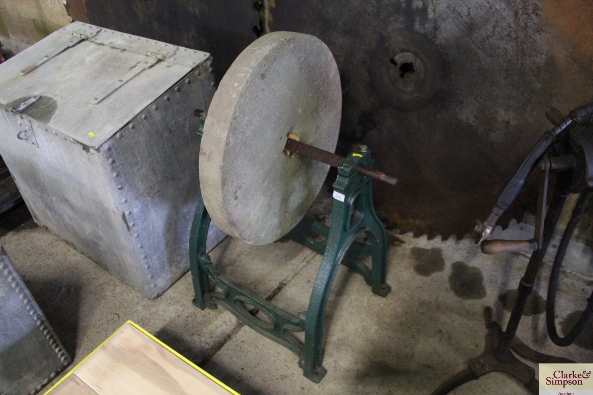 A sharpening stone on cast iron stand