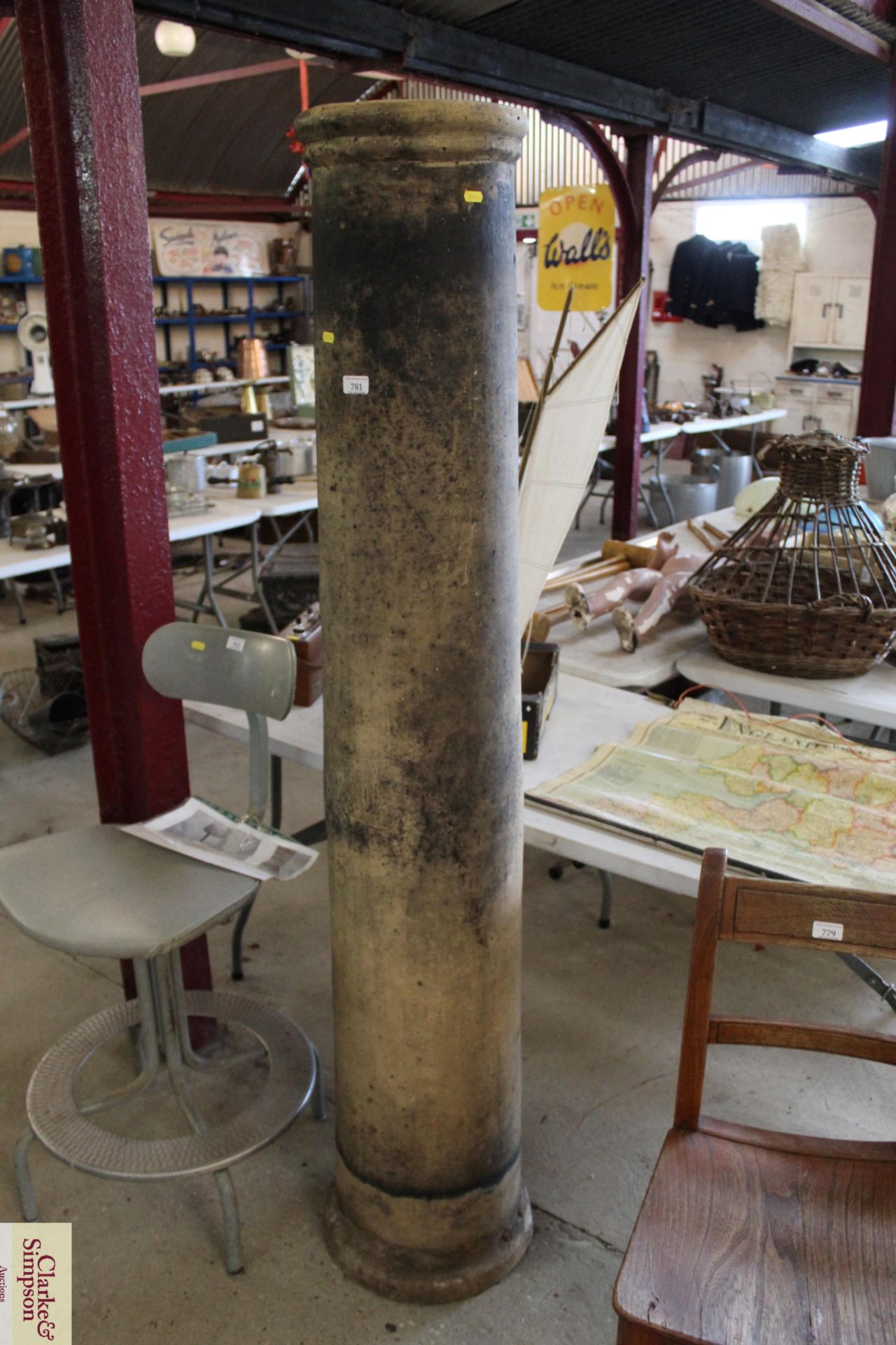 A tall chimney pot approx. 69"