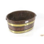 A 19th Century brass bound oak wine cooler or jard