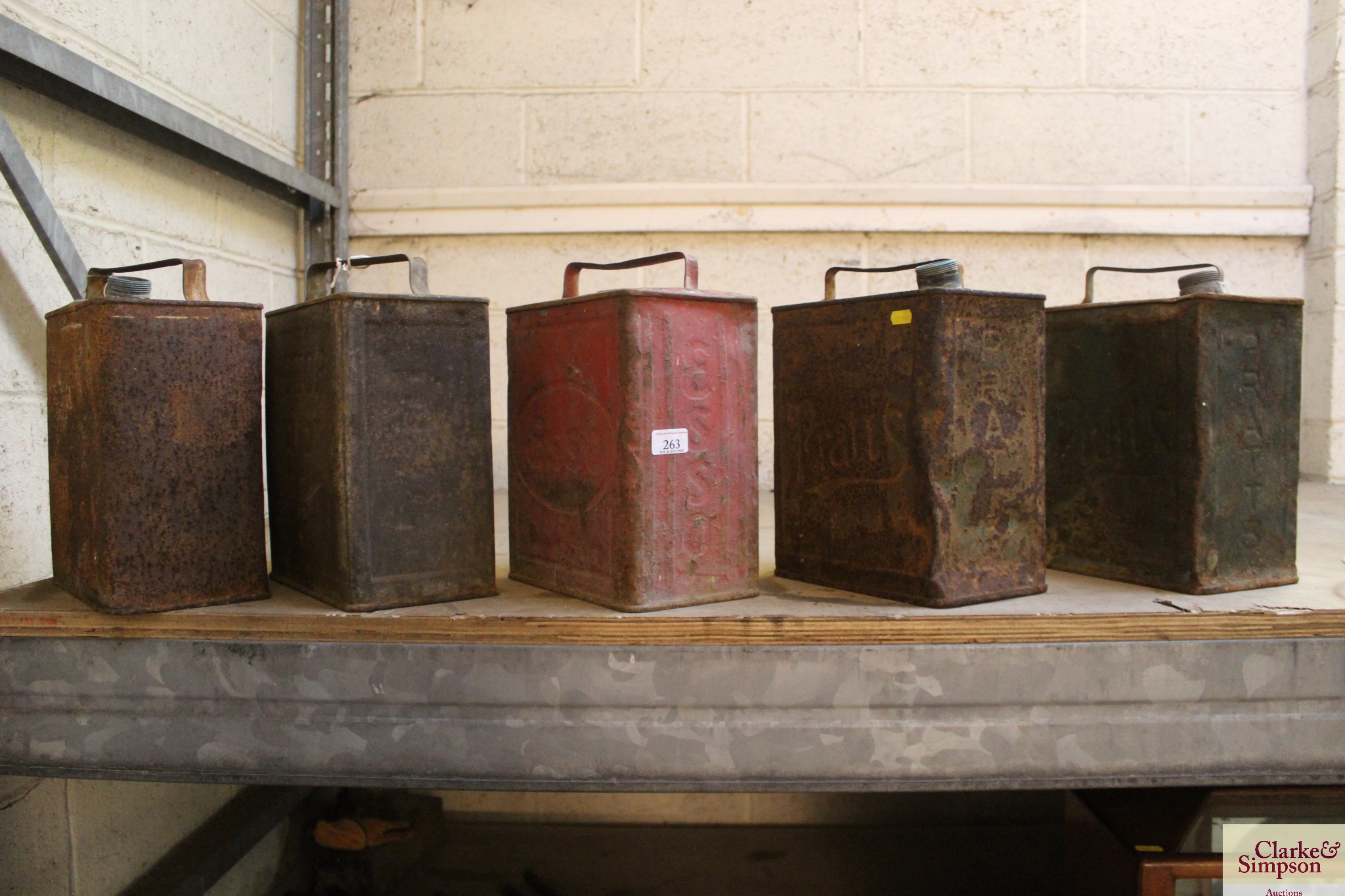 Five various two gallon petrol cans including Esso