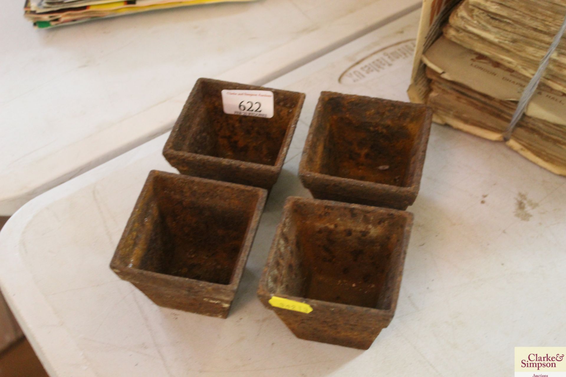 Four small cast iron pots