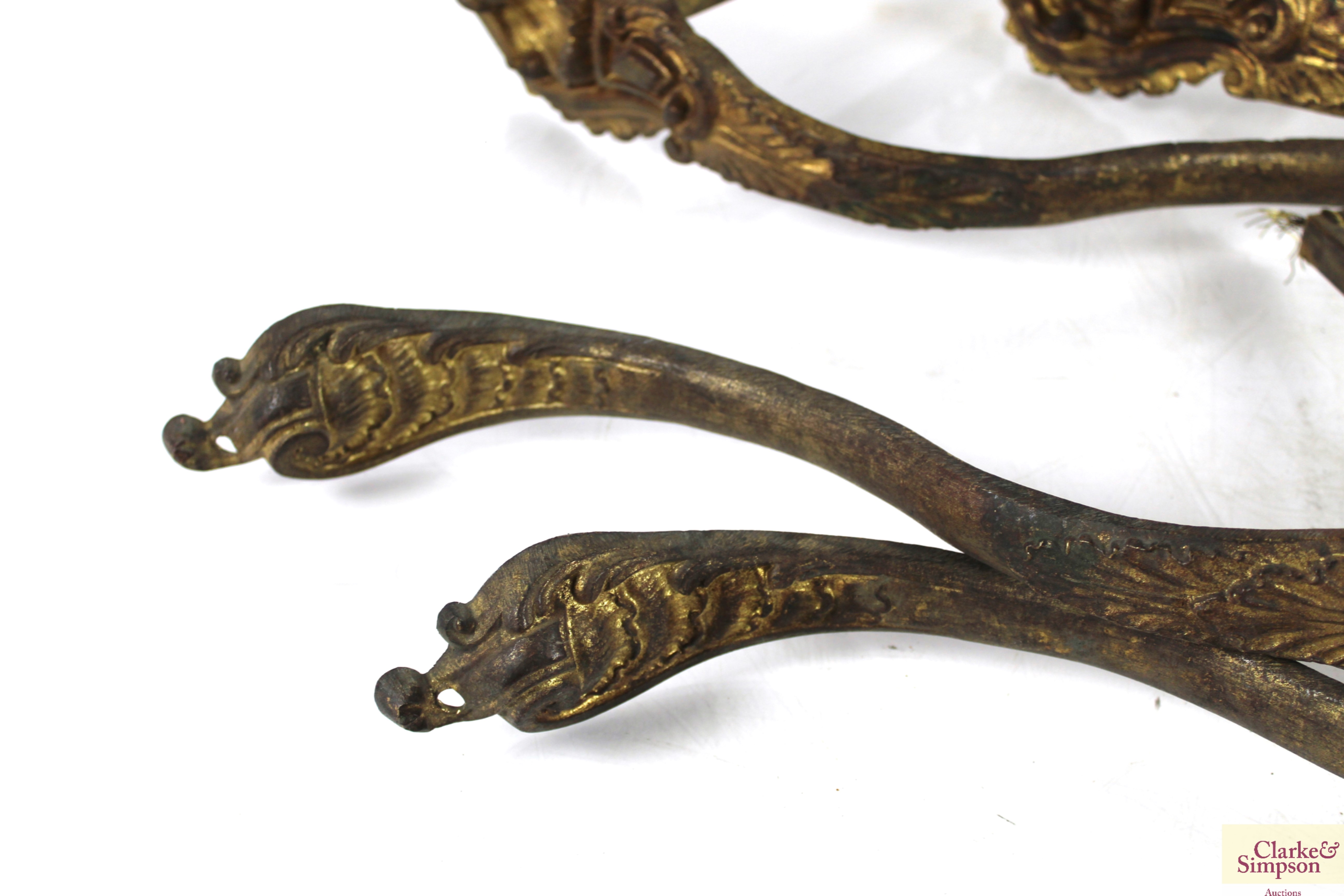 A set of four 19th Century gilded brass curtain ti - Image 5 of 5