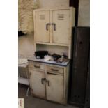 A vintage enamel kitchen cabinet