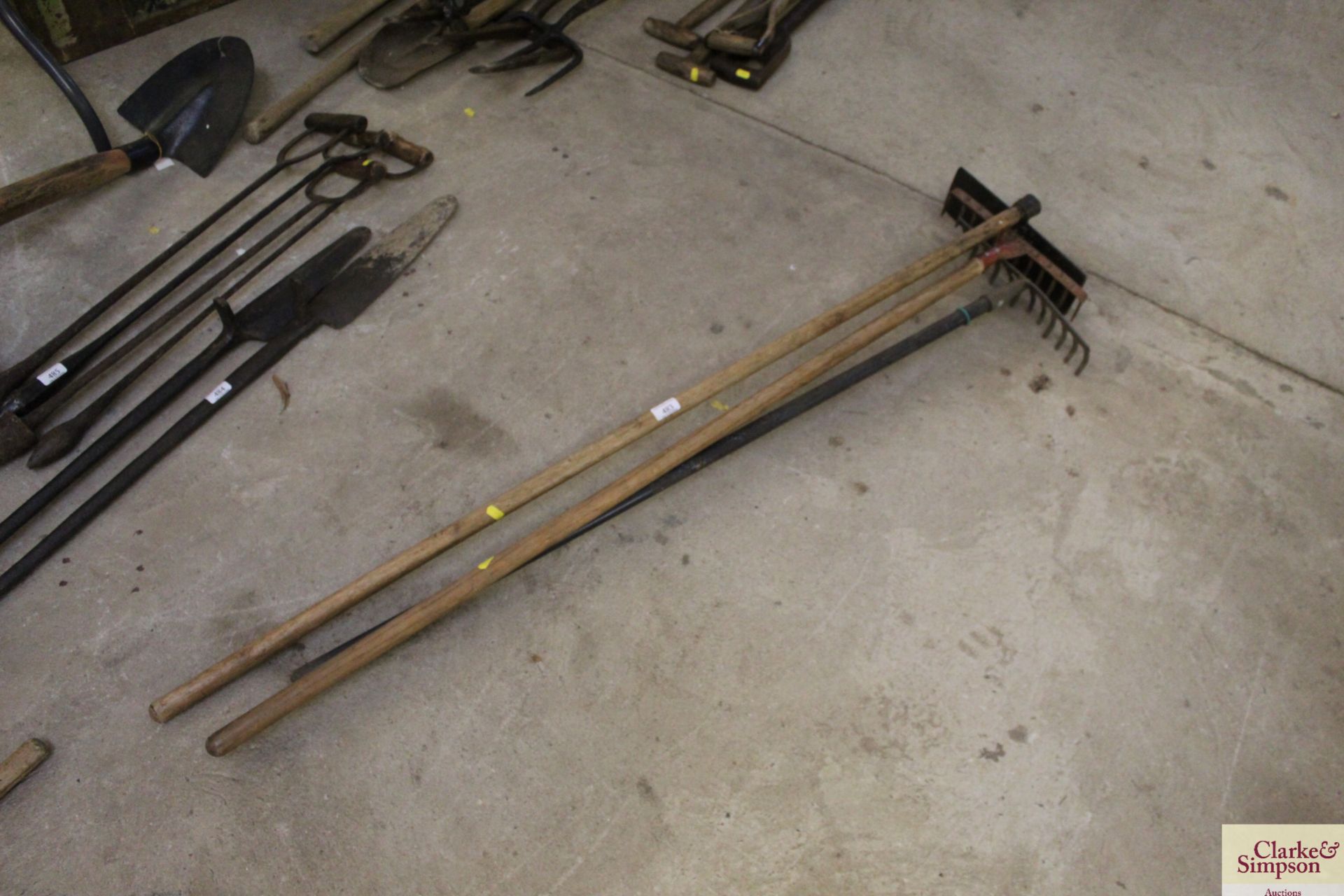 A quantity of rakes and a scraper