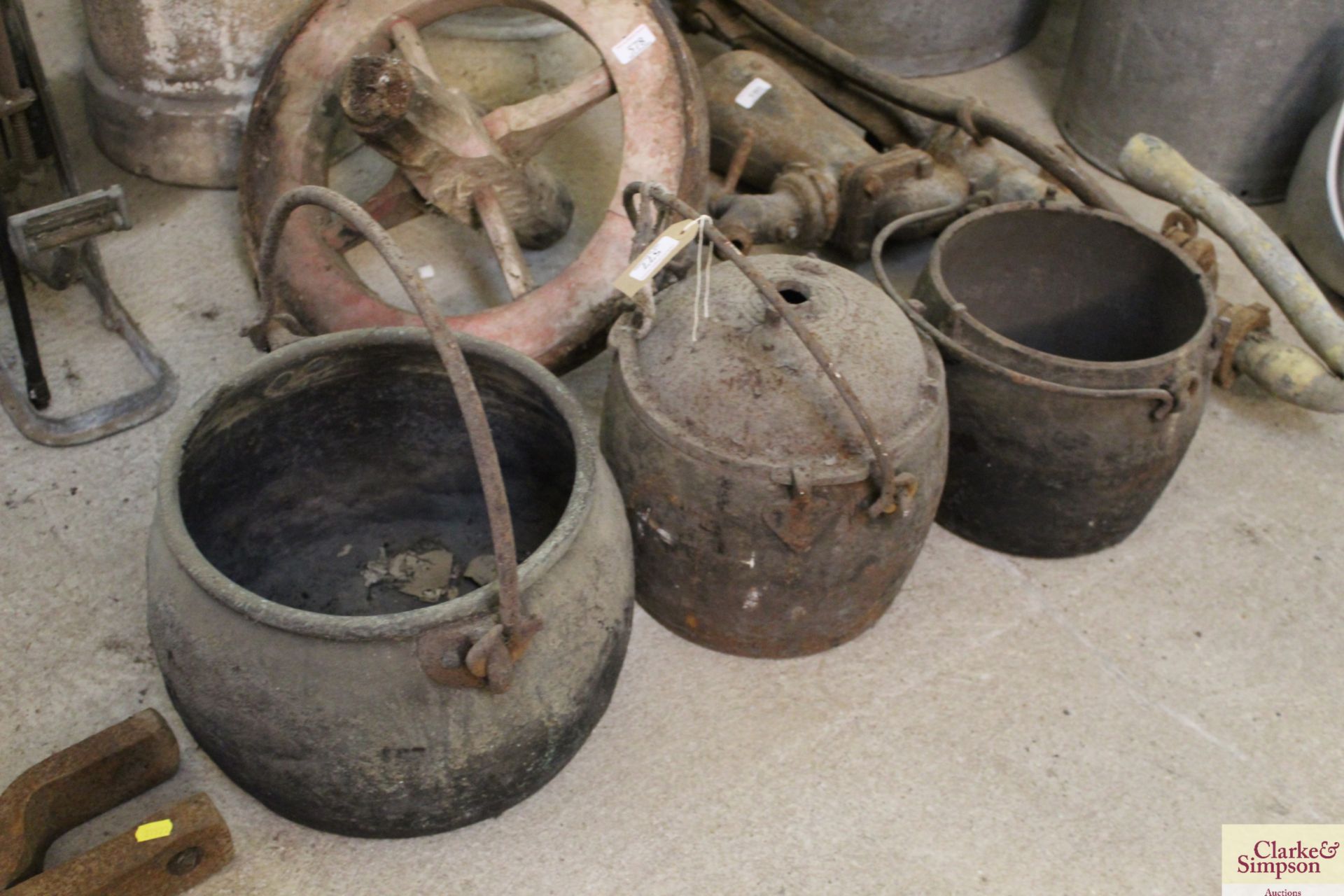 Three vintage cast iron cooking pots