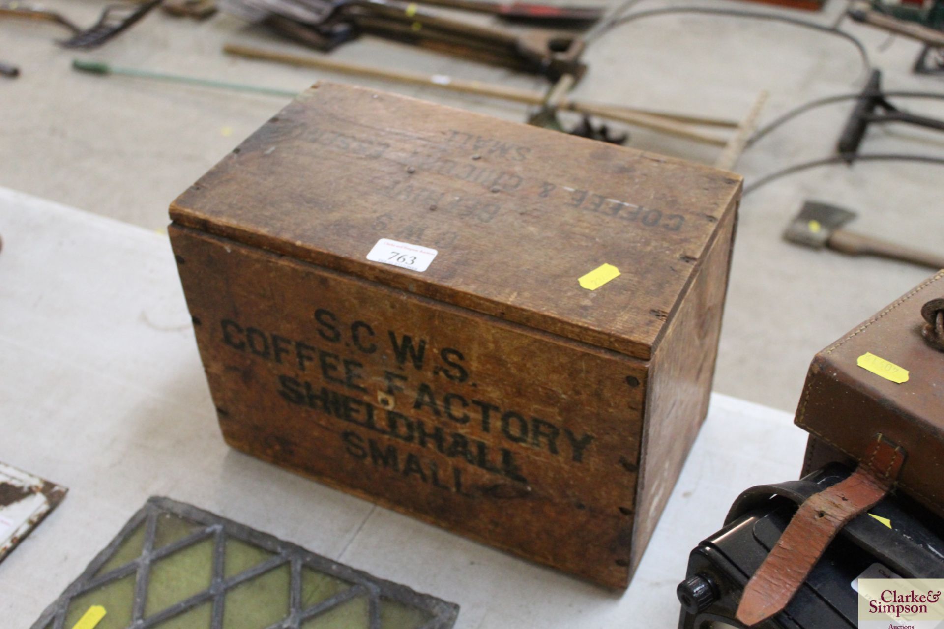 A small "SCWS Coffee Factory" storage box