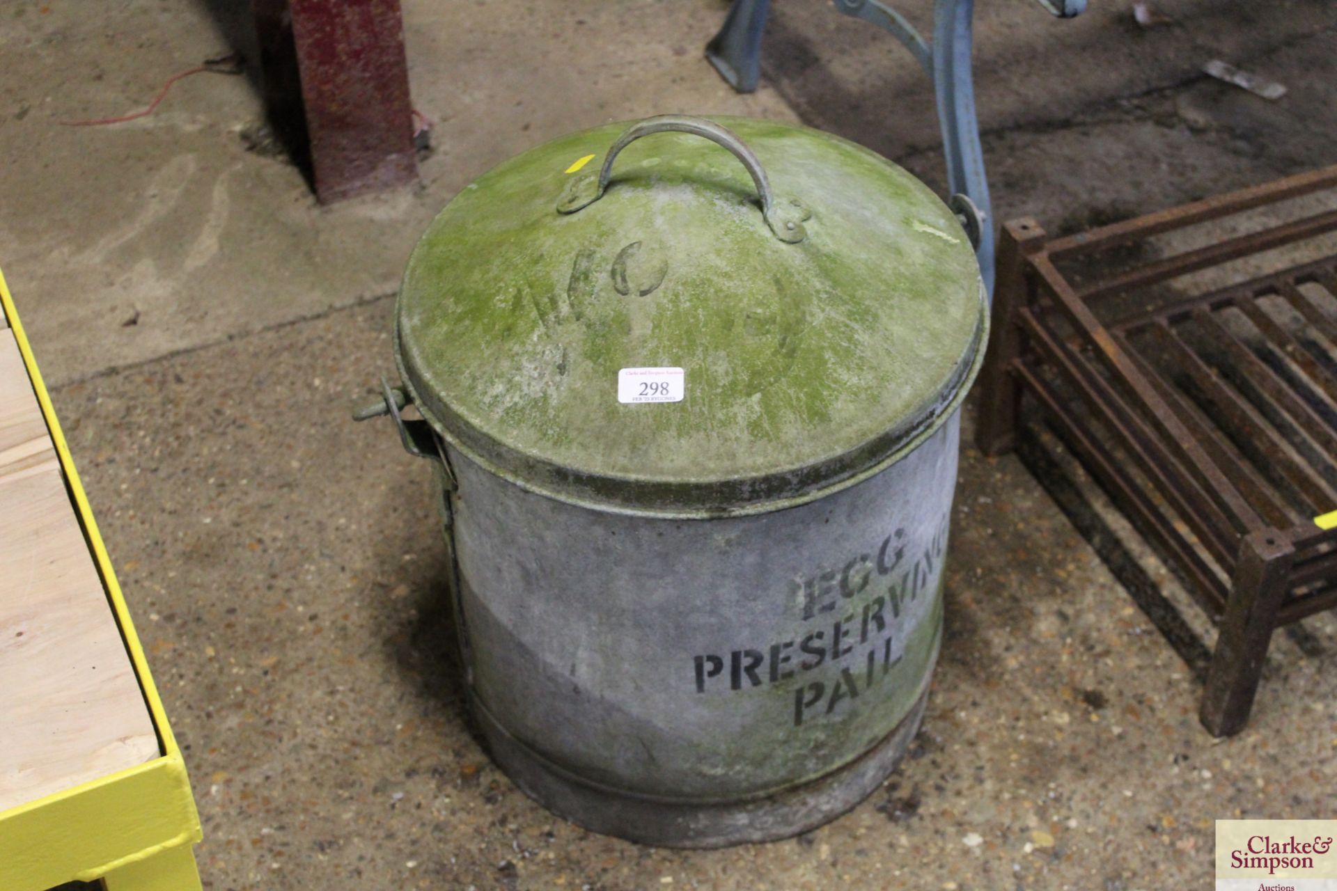 A galvanised lidded egg preserving pail