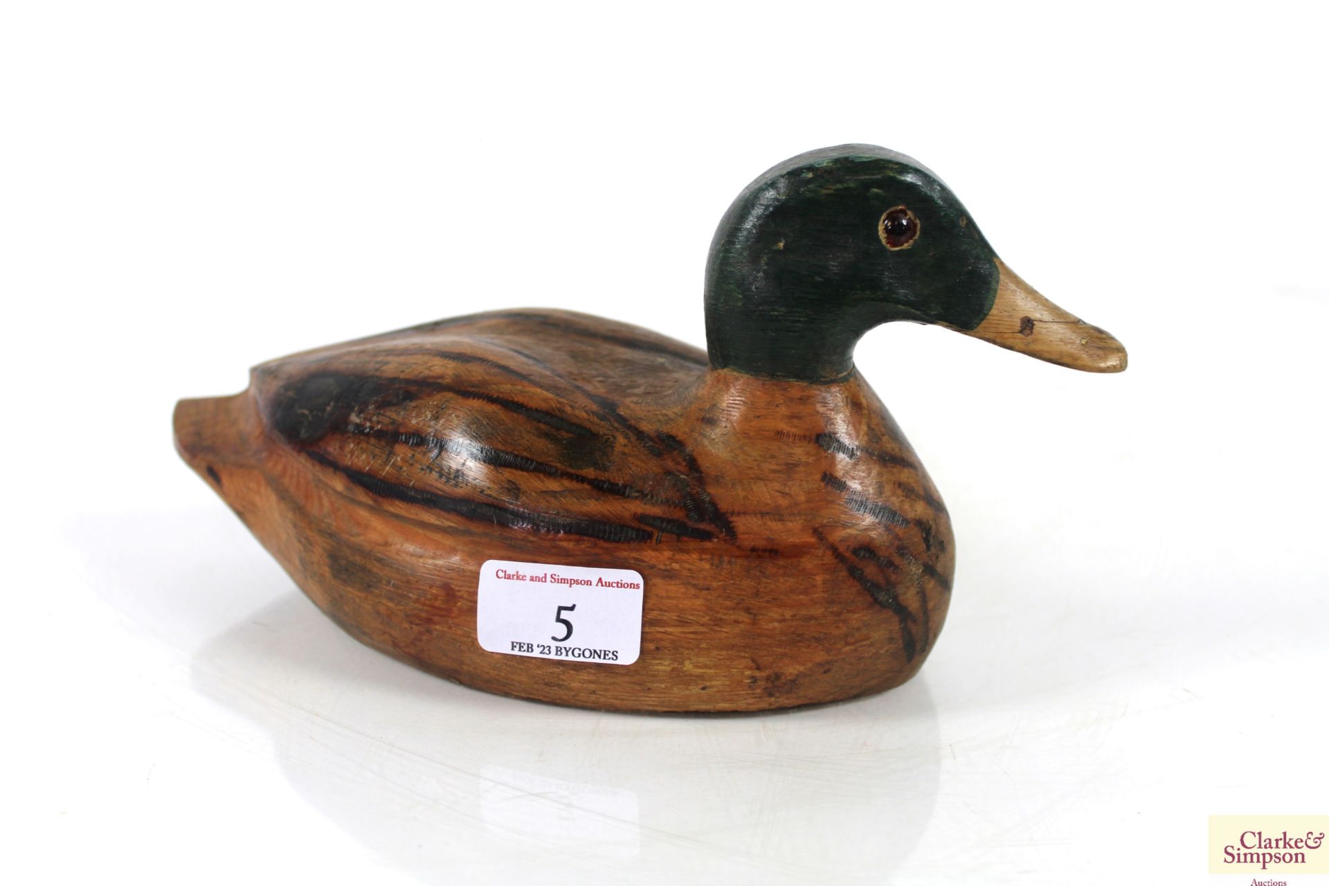 A wooden decoy duck