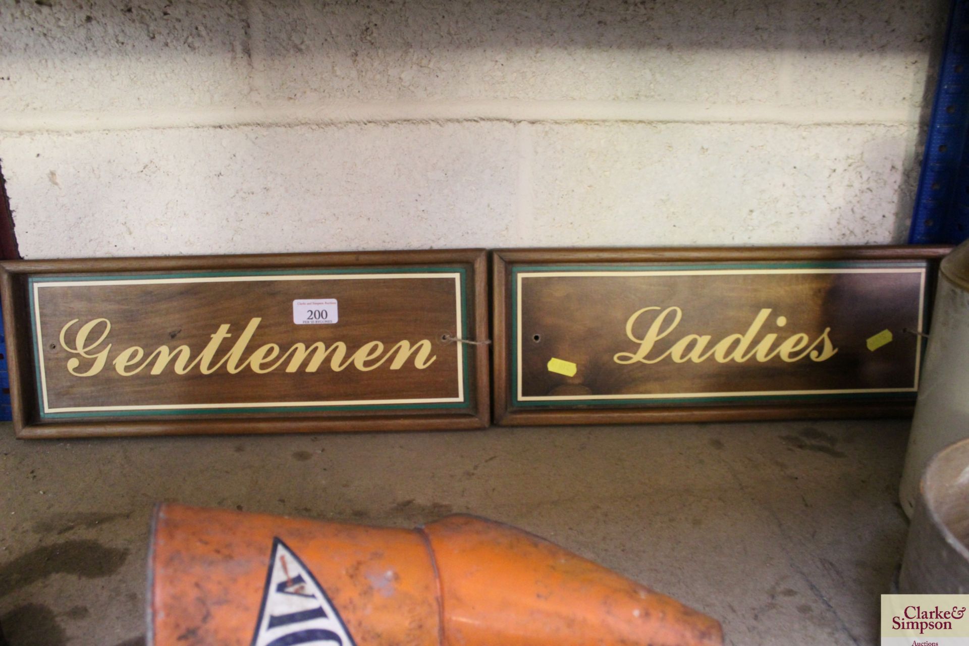 "Ladies and Gentleman's" signs