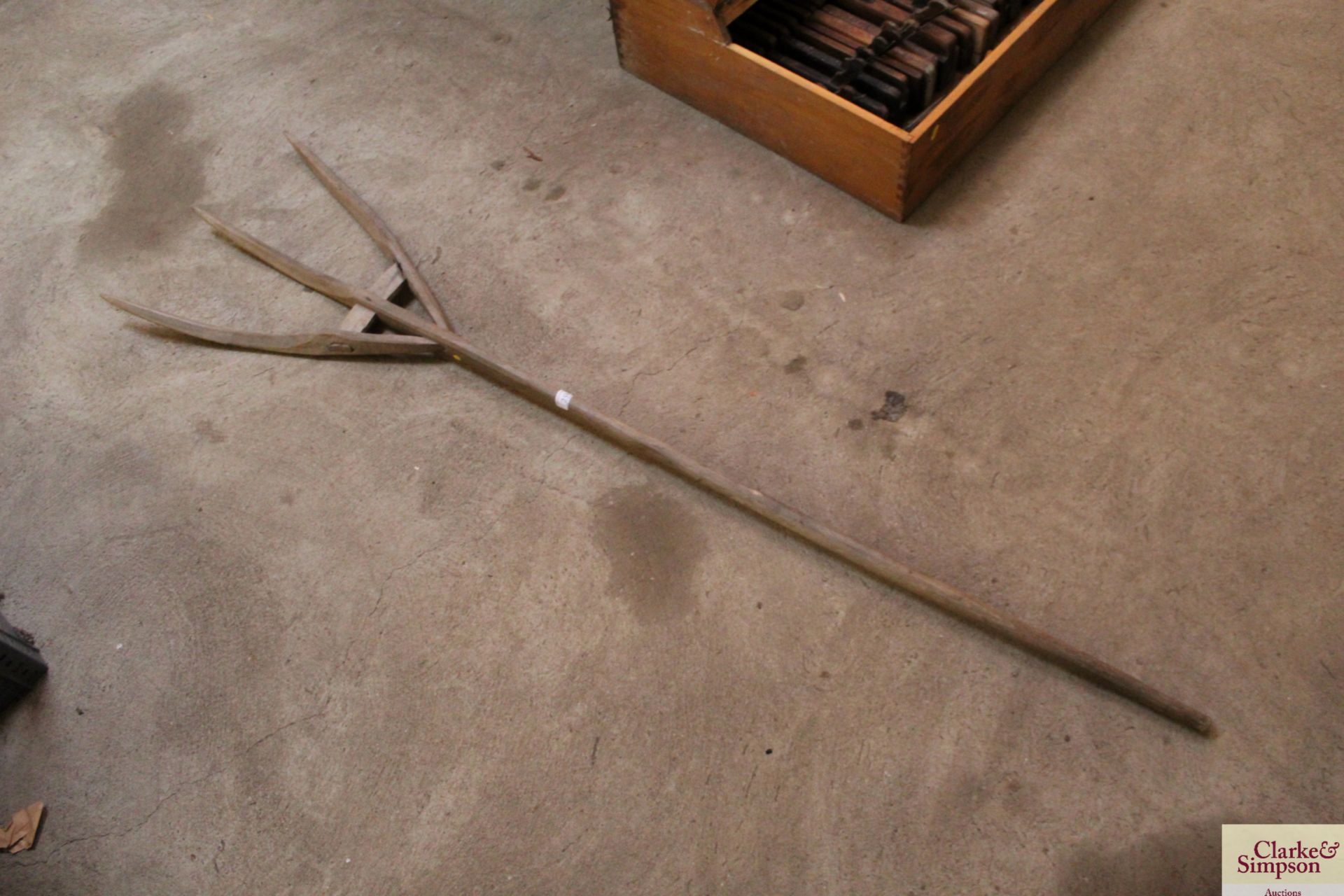 A vintage wooden three tine fork