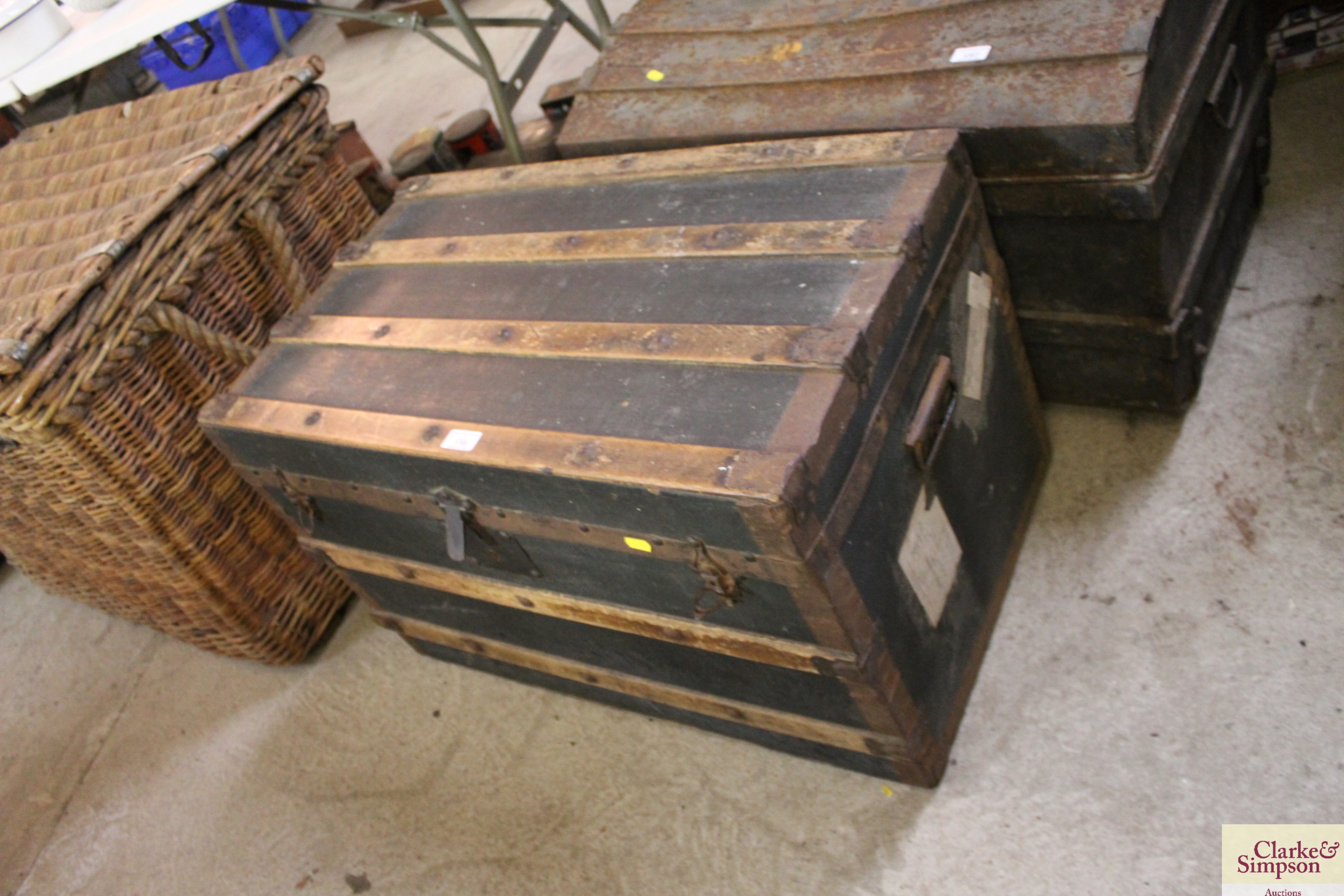 A canvas and wood and metal bound travelling trunk