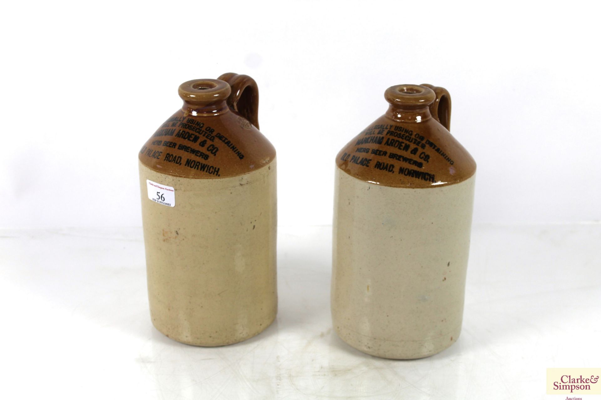 Two stoneware bottles named to Markham Arden & Co. Herb Beer Brewers of Old Palace Road Norwich