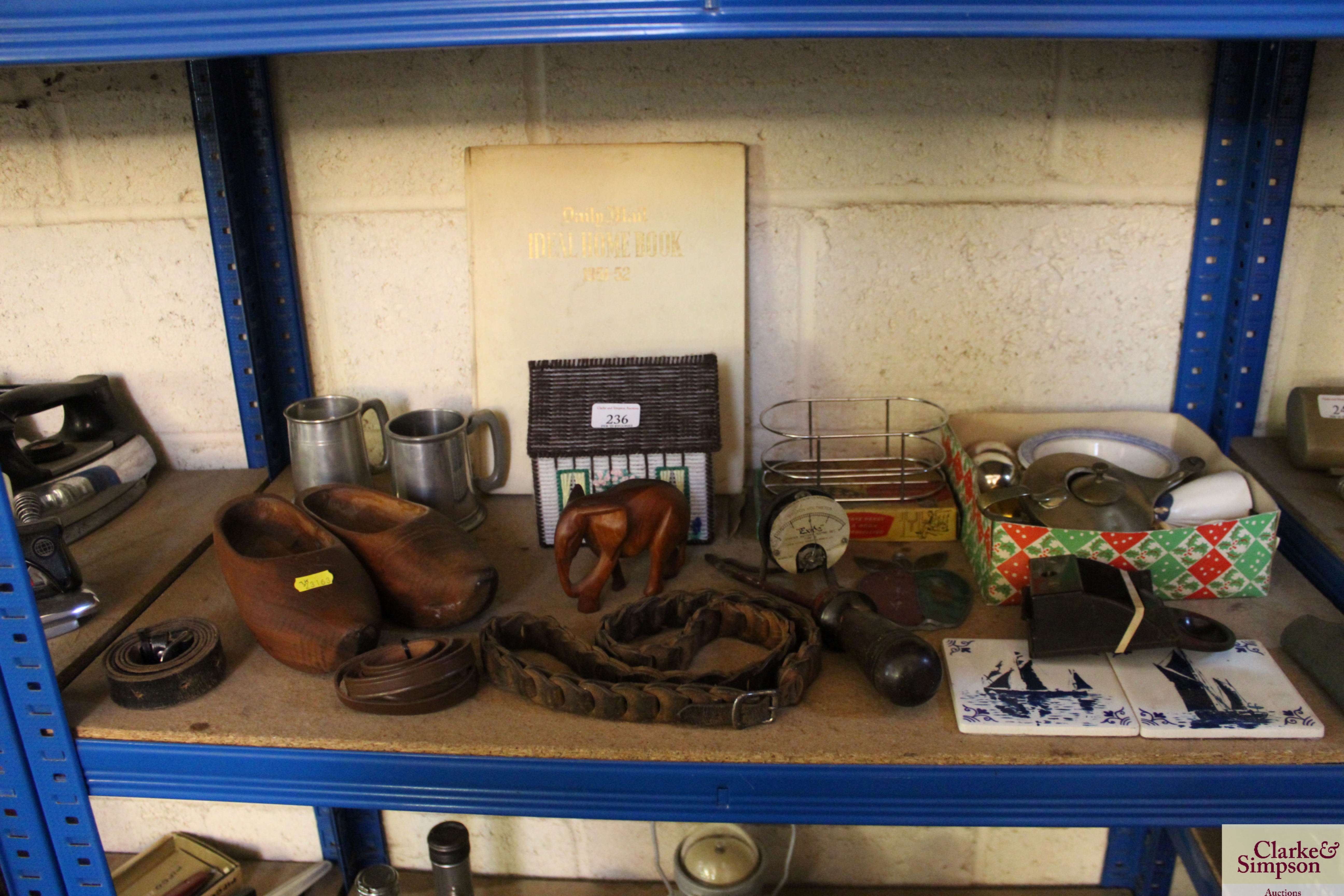 A pair of wooden clogs, two tankards, a small leat