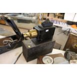 A vintage Magic Lantern with metal case