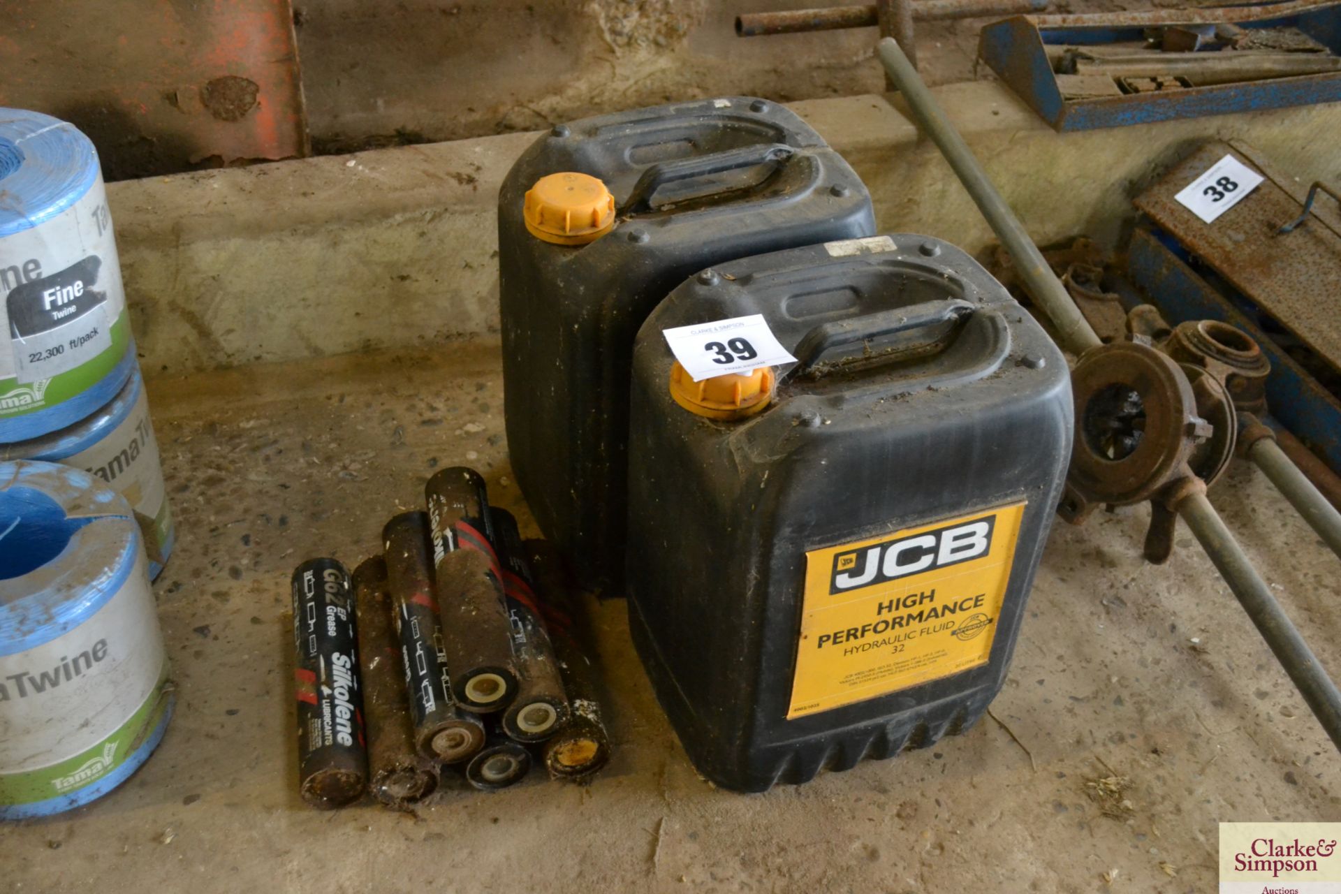 2x 20L JCB hydraulic oil and quantity of grease gun cartridges. V