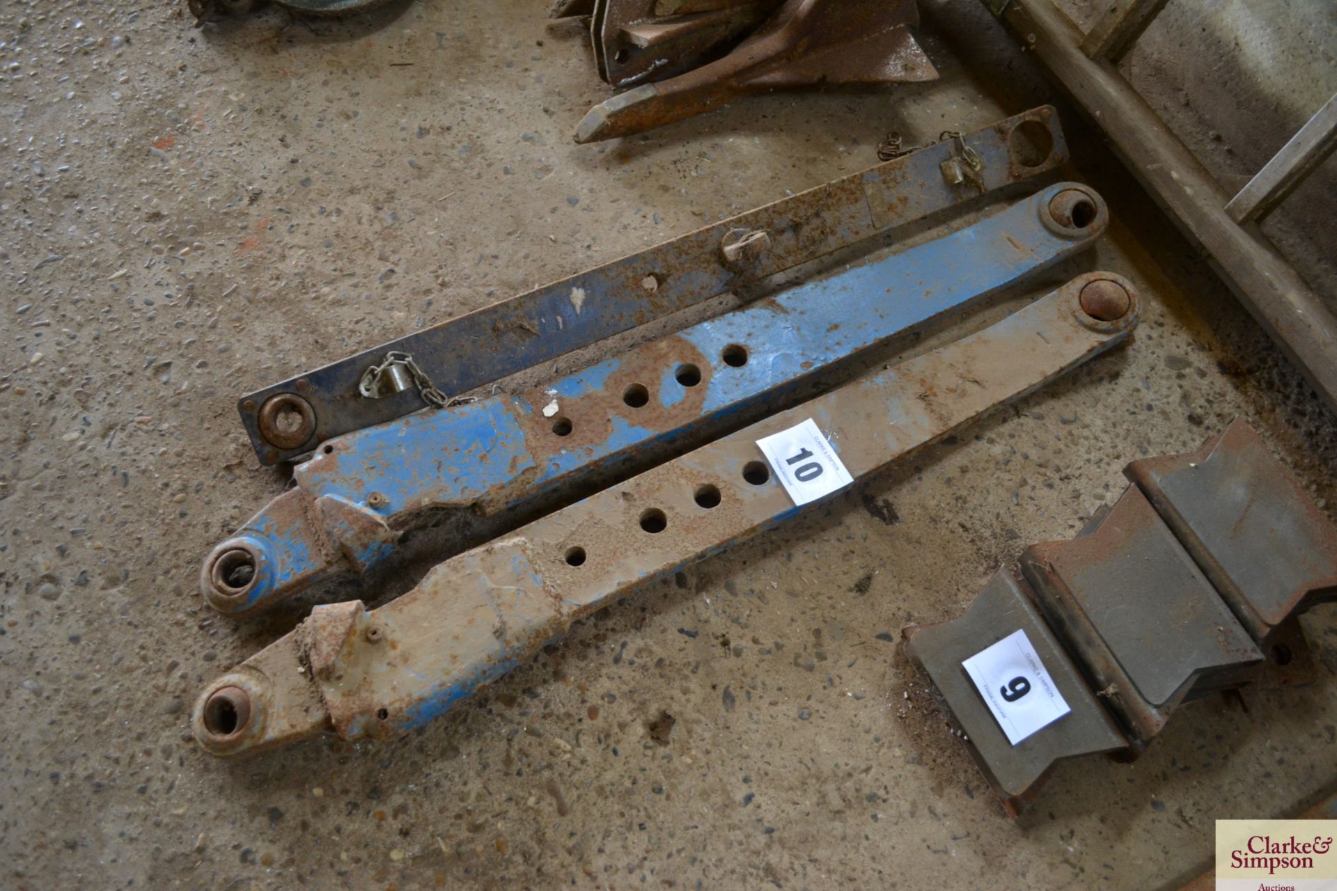 Two Ford link arms and a Leyland link arm. V